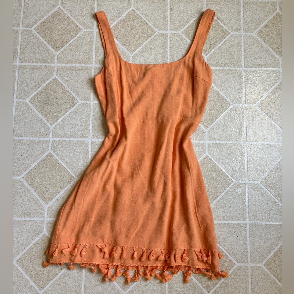 Orange Lulu’s feel the sunshine tassel mini dress